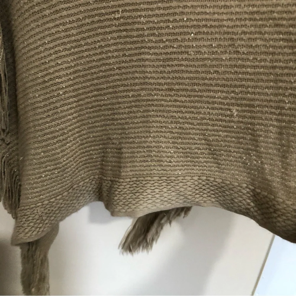 Tan knitted metallic gold fringe hem poncho